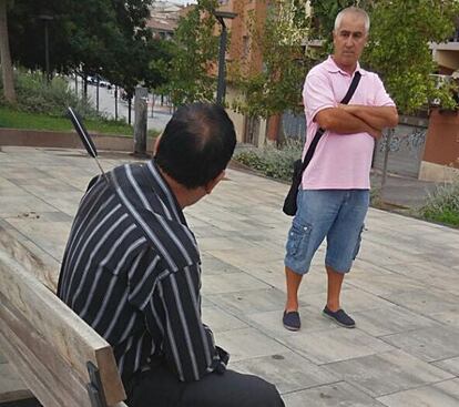 One of the victims, with the attacker’s knife still in his back, waits for the emergency services to arrive.