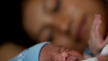 Maidaly, 20, rests hours after giving birth to her son David Abraham at Roosevelt Hospital in Guatemala City, Thursday, May 10, 2012. Guatemalans celebrate Mother's Day on May 10. (AP Photo/Rodrigo Abd)