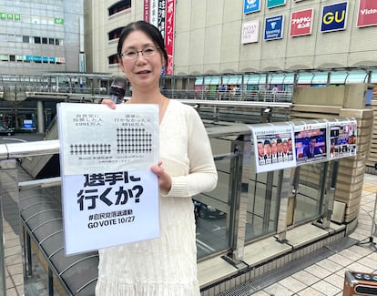 Emiko Ogahara asks passersby to vote to sink the Liberal Democratic Party at the gates of Hachioji station, on the outskirts of Tokyo, this Sunday.