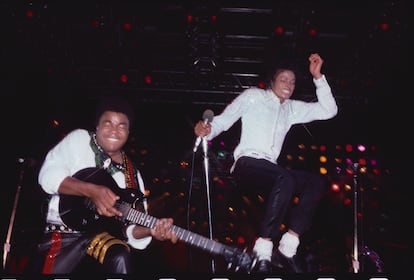 Tito Jackson and Michael Jackson perform on the Jackson Five tour in 1984.