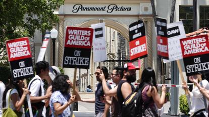 Striking WGA (Writers Guild of America) workers picket outside Paramount Studios on July 12, 2023, in Los Angeles, California.