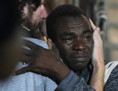 A migrant reacts as he disembarks the Spanish rescue ship ‘Open Arms.’