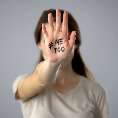 Woman with me too sign on hand, movement against sexual harassment