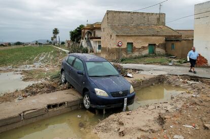 A damaged car on a road in Orihuela, which was isolated for three days due to flooded roads.