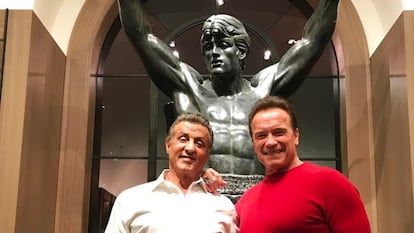 Sylvester Stallone and Arnold Schwarzenegger, in front of a statue of Rocky Balboa, in an image from the former's Instagram.