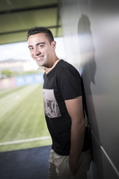 Xavi posa al camp Tito Vilanova.