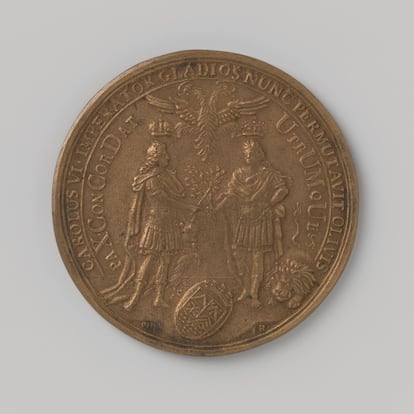 Medalla de bronce del Tratado de Viena entre Españla y Austria. En la pieza aparecen Carlos VI y Felipe V sosteniendo sendas ramas de olivo.