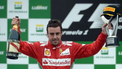 Fernando Alonso celebrates his second place position at the Brazil GP.