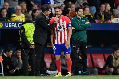 Koke y Diego Simeone