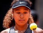 Japan's Naomi Osaka prepares to serve to Japan's Misaki Doi during their match at the Mutua Madrid Open tennis tournament in Madrid, Spain, Friday, April 30, 2021. (AP Photo/Bernat Armangue)