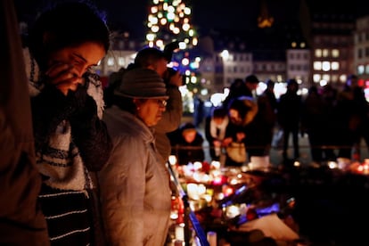 Una mujer reacciona durante el tributo a las víctimas, el 13 de diciembre de 2018.