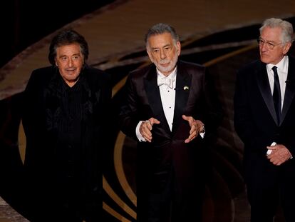 Al Pacino, from left, Francis Ford Coppola and Robert De Niro appear on stage during a "Godfather" reunion at the Oscars on Sunday, March 27, 2022, at the Dolby Theatre in Los Angeles. (AP Photo/Chris Pizzello)