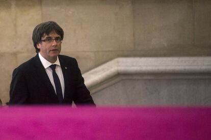 Regional premier Carles Puigdemont arrives in parliament.