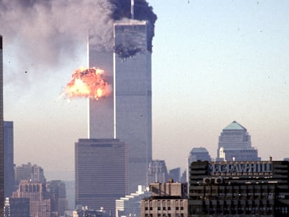 (FILES) In this file photo taken on September 10, 2001, a hijacked commercial plane crashes into the World Trade Center in New York. - The remains of two more victims of 9/11 have been identified, thanks to advanced DNA technology, New York officials announced on September 8, 2021, just days before the 20th anniversary of the attacks. The office of the city's chief medical examiner said it had formally identified the 1,646th and 1,647th victim of the al-Qaeda attacks on New York's Twin Towers which killed 2,753 people. They are the first identifications of victims from the collapse of the World Trade Center since October 2019. (Photo by SETH MCALLISTER / AFP)