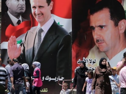 Vecinos de Damasco pasean junto a carteles de El Asad.
