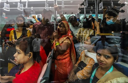 Passengers on a New Delhi bus on November 14.