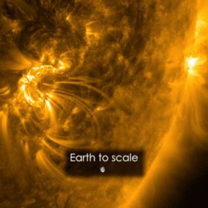 Imagen del tamaño de la llamarada solar, comparada con la Tierra.