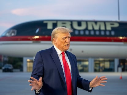 Former president Donald Trump speaks with reporters before departure from Hartsfield-Jackson Atlanta International Airport, on Aug. 24, 2023, in Atlanta.