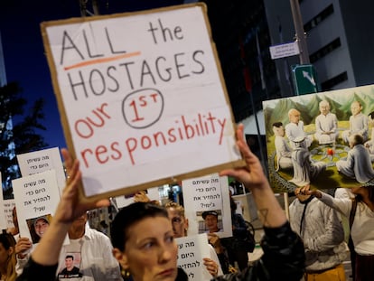 Protesters hold signs demanding the liberation of hostages who are being held in the Gaza Strip after they were seized by Hamas gunmen on October 7, in Tel Aviv, Israel, November 21, 2023.