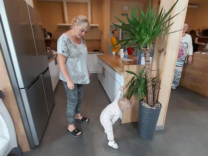 Olga Shevchenko, a refugee from Luhansk, with her young daughter in the Lviv center.