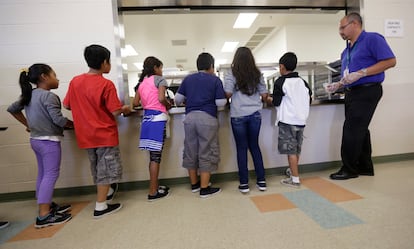 Detained children line up in the cafeteria at a detention center for immigrant families in Karnes County in 2014.