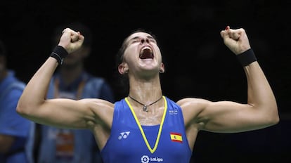 Carolina Marin of Spain reacts after beating Pusarla V. Sindhu of India in their women's badminton championship match at the BWF World Championships in Nanjing, China, Sunday, Aug. 5, 2018. (AP Photo/Mark Schiefelbein)