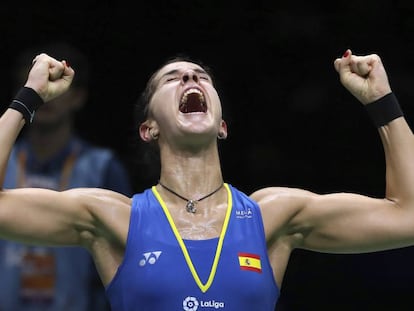 Carolina Marin of Spain reacts after beating Pusarla V. Sindhu of India in their women's badminton championship match at the BWF World Championships in Nanjing, China, Sunday, Aug. 5, 2018. (AP Photo/Mark Schiefelbein)