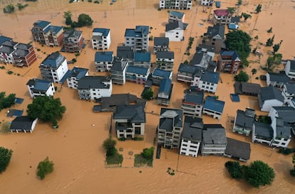 Houses surrounded by floodwaters in China’s Jiangxi province; June 21, 2022.