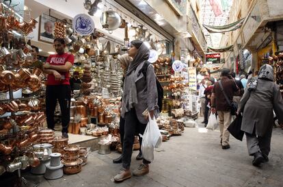 Iranians shop at the Tajrish bazaar in Tehran, Iran, on August 21, 2023.