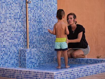 Natalia López, a working mother, with her three-year-old son.