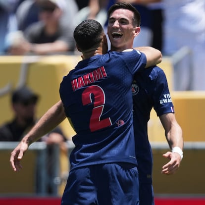 Paris Saint-Germain's Fabian Ruiz, right, celebrates with teammate Achraf Hakimi after scoring the opening goal during the Club World Cup group B soccer match between PSG and Atletico Madrid in Pasadena, Calif., Sunday, June 15, 2025. (AP Photo/Jae Hong)