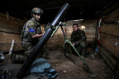 Ukrainian service members prepare a mortar at their position near a frontline, amid Russia's attack on Ukraine, in Zaporizhzhia region, Ukraine, on September 4, 2023.