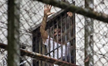 Leopoldo López greets a crowd from a window at the military prison Ramo Verde in Caracas.