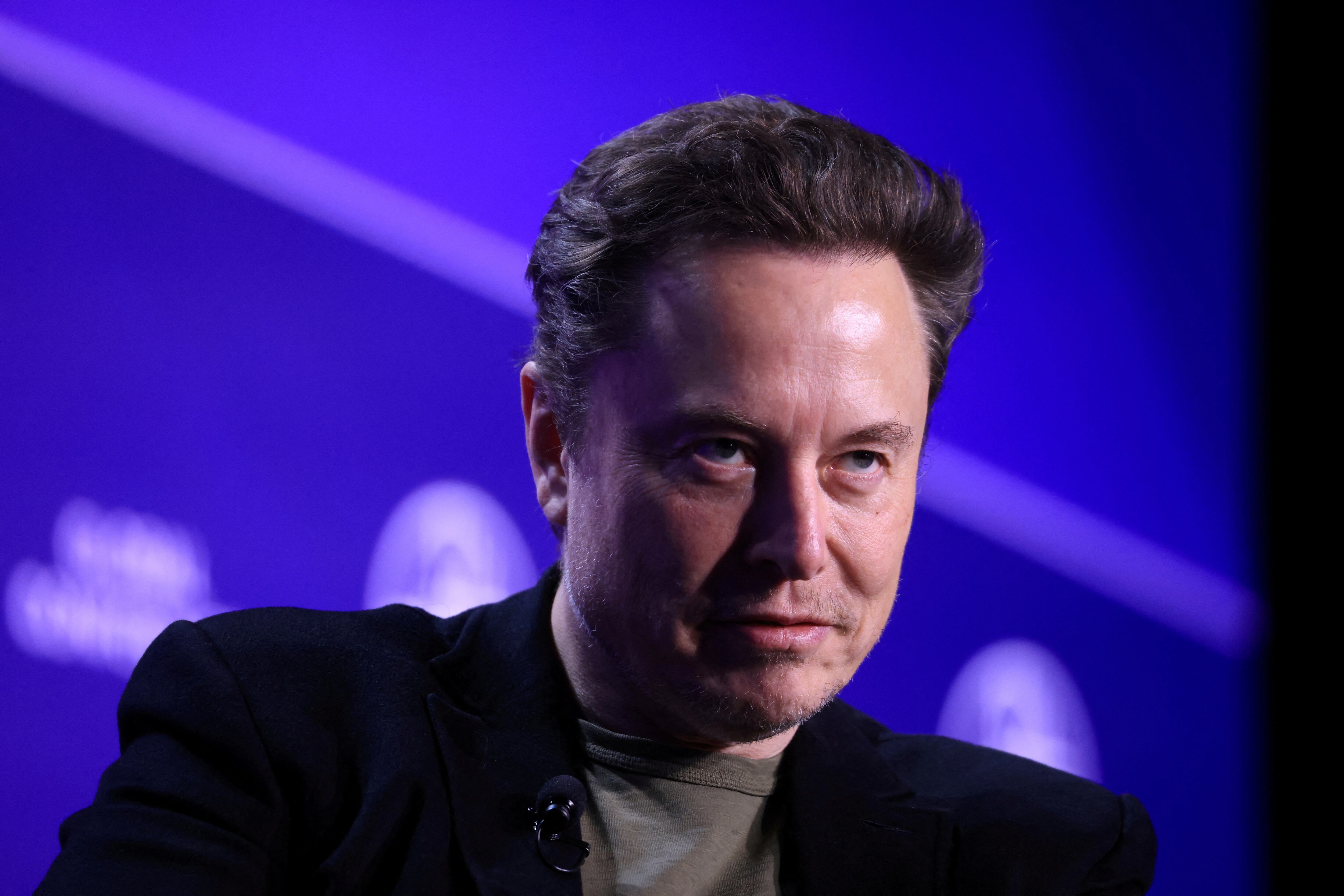 FILE PHOTO: Elon Musk, Chief Executive Officer of SpaceX and Tesla and owner of X looks on during the Milken Conference 2024 Global Conference Sessions at The Beverly Hilton in Beverly Hills, California, U.S., May 6, 2024.  REUTERS/David Swanson/File Photo