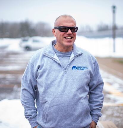 Thomas Rhodes smiles as he walked out of a Minnesota state prison on Friday, Jan. 13, 2023, in Moose Lake, Minn. Rhodes had been convicted of murder in the 1996 death of his wife and had served 25 years before authorities vacated his murder conviction on Friday, citing flawed testimony from an expert witness. He instead pleaded guilty to manslaughter on Friday and got credit for time served. (Fong Lee via AP)