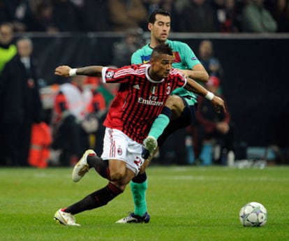 Busquets, junto a Boateng en el partido del miércoles contra el Milan.