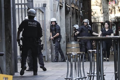 Police searching the Ramblas area shortly after the attack.