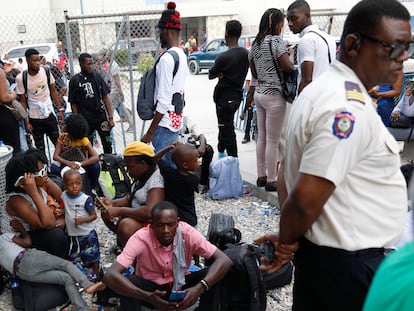 Haitians waiting to board a flight to Nicaragua