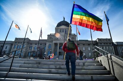 Demonstrators gather on the steps of the Montana state Capitol protesting anti-LGBTQ+ legislation in Helena, Mont., March 15, 2021.