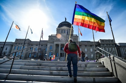 Demonstrators gather on the steps of the Montana state Capitol protesting anti-LGBTQ+ legislation in Helena, Mont., March 15, 2021.