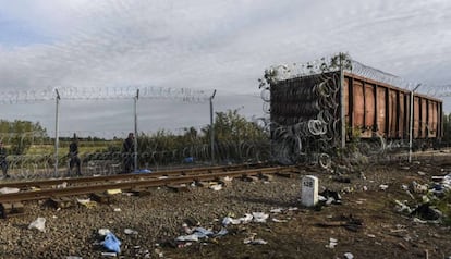 Hungarian police patrol a railroad on the frontier with Serbia.