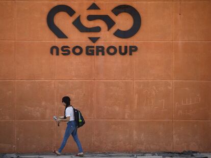 A woman walks by the building entrance of Israeli cyber company NSO Group at one of its branches in the Arava Desert on November 11, 2021 in Sapir, Israel.
