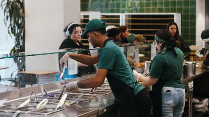 Workers inside a restaurant in New York, on April 22, 2024.