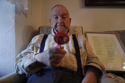 Martín de la Torre holds the rattle that his mother took with her to the grave in September 1936.