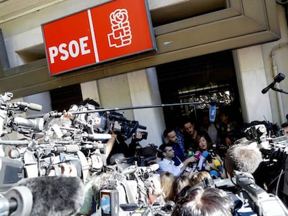 The media congregates outside the Socialist Party HQ in Madrid.