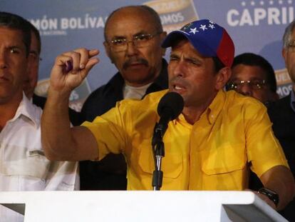Venezuela&#039;s opposition leader Henrique Capriles gestures during a news conference in Caracas on Monday. 