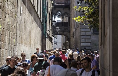 Tourists filling up Barcelona's Gothic neighborhood.