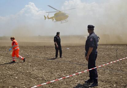 A rescue helicopter approaches the scene of a train accident after two commuter trains collided head-on near the town of Andria, in the southern region of Puglia, killing several people, Tuesday, July 12, 2016.  (AP Photo/Gaetano Lo Porto)