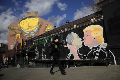 A mural next to a train station in Vilnius, the capital of Lithuania. The original mural showed Donald Trump, the President of the United States, and Vladimir Putin, the President of Russia, kissing on the lips. It was repainted when neighbors complained. 