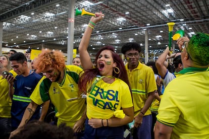 A woman shouts during the game. 